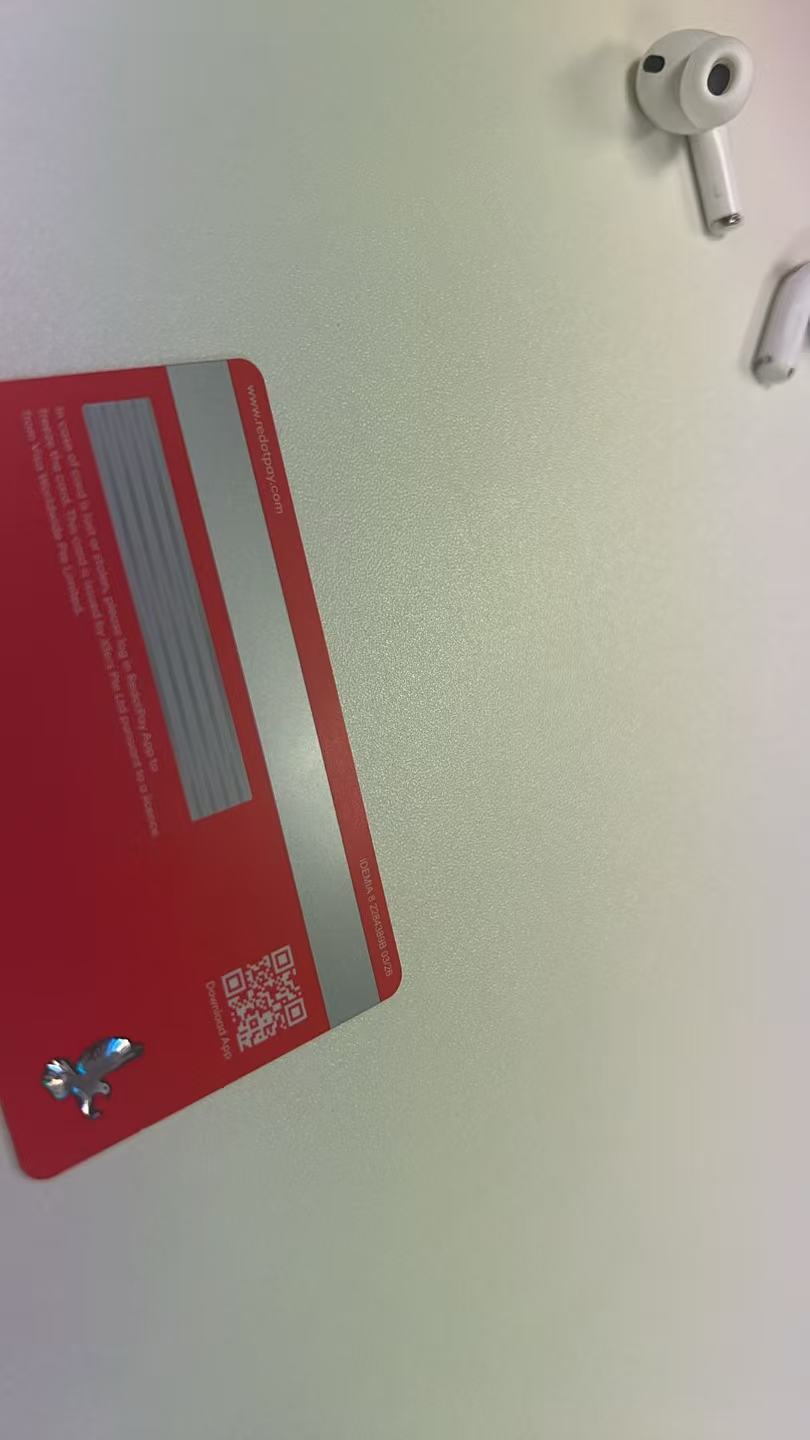 Back of RedotPay physical card showing magnetic stripe and QR code