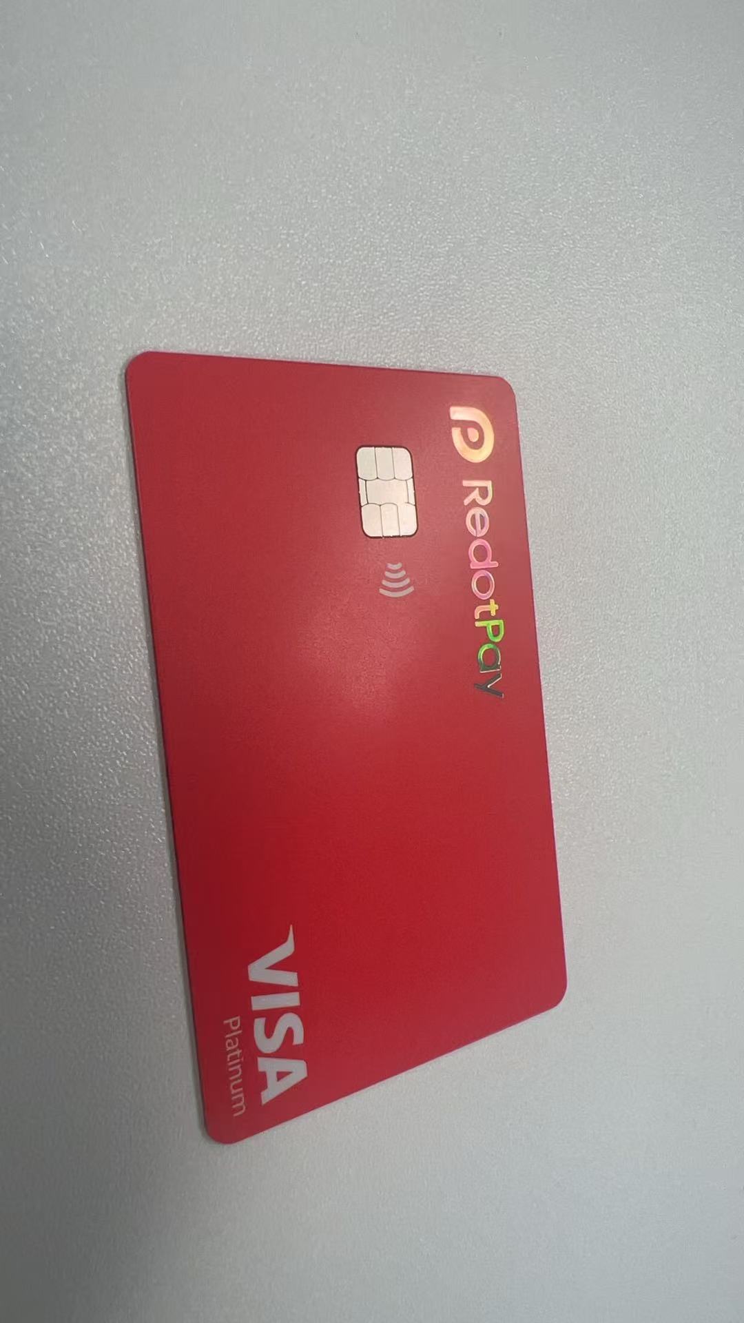 Front of RedotPay physical Visa Platinum card with chip and contactless symbol