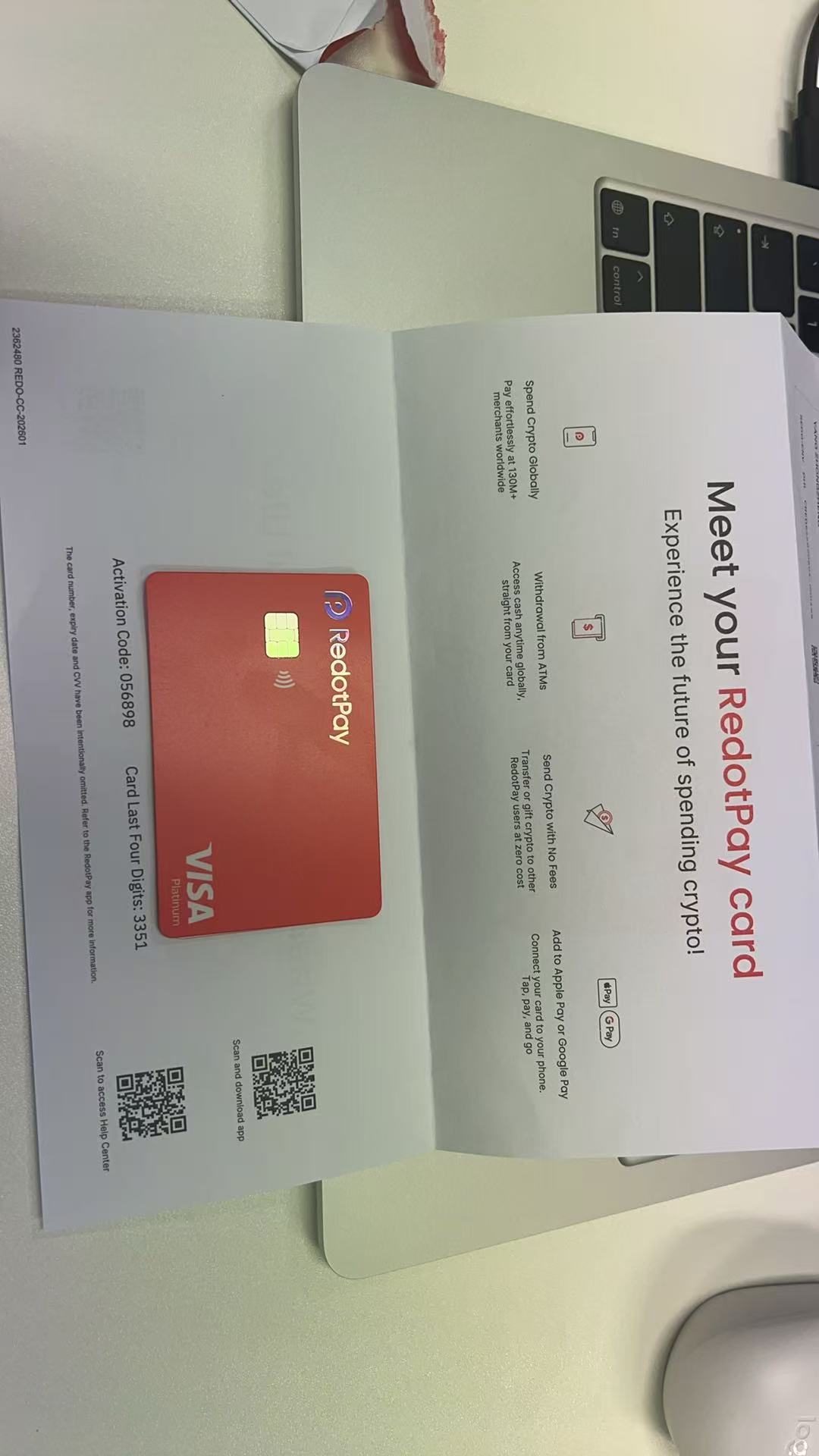 RedotPay card package showing card, welcome letter and activation code